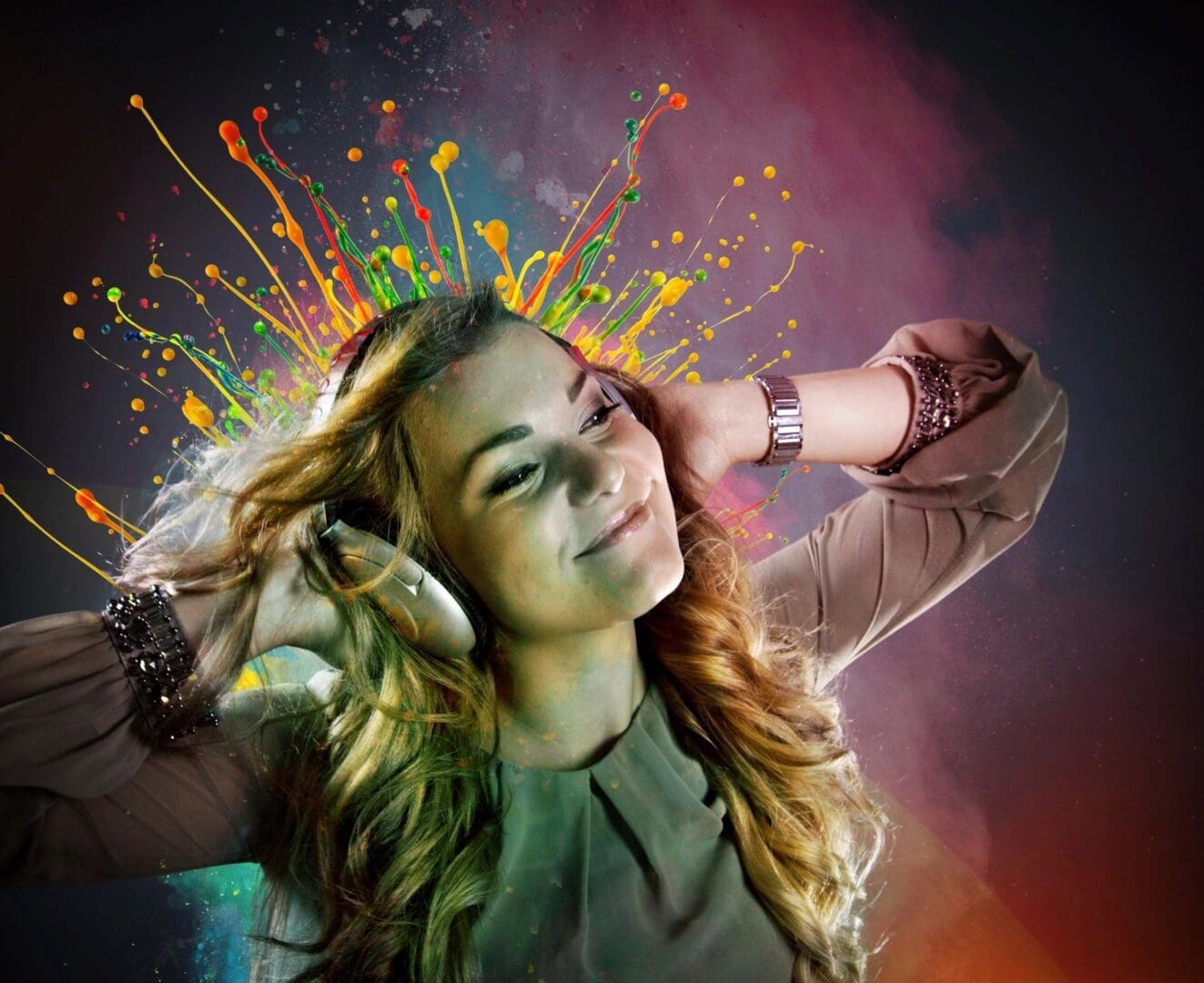 A woman with headphones on and colorful background